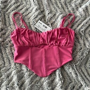 Pink cut out detail corset like top